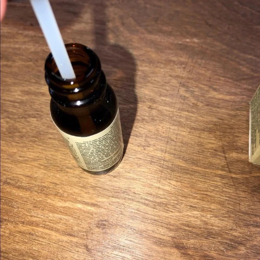 Pure tea tree oil in glass bottle